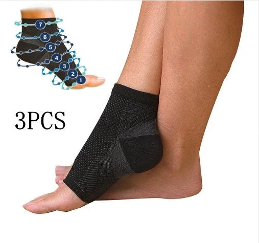 Anti-fatigue compression foot sleeve in black, red, or white, featuring moisture-wicking fabric and a heel hole for breathability.