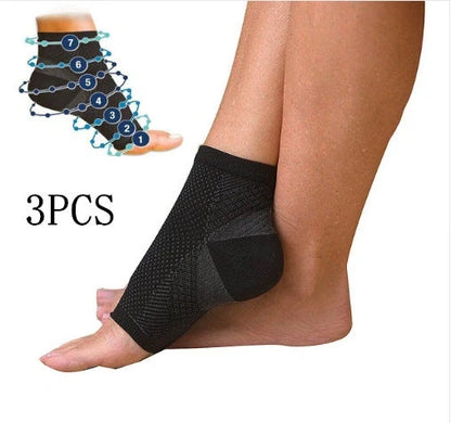 Anti-fatigue compression foot sleeve in black, red, or white, featuring moisture-wicking fabric and a heel hole for breathability.