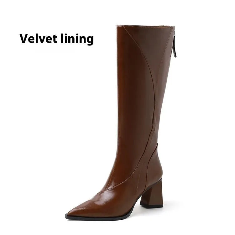 Women's black retro high heel riding boots with a waterproof platform and cowhide upper.