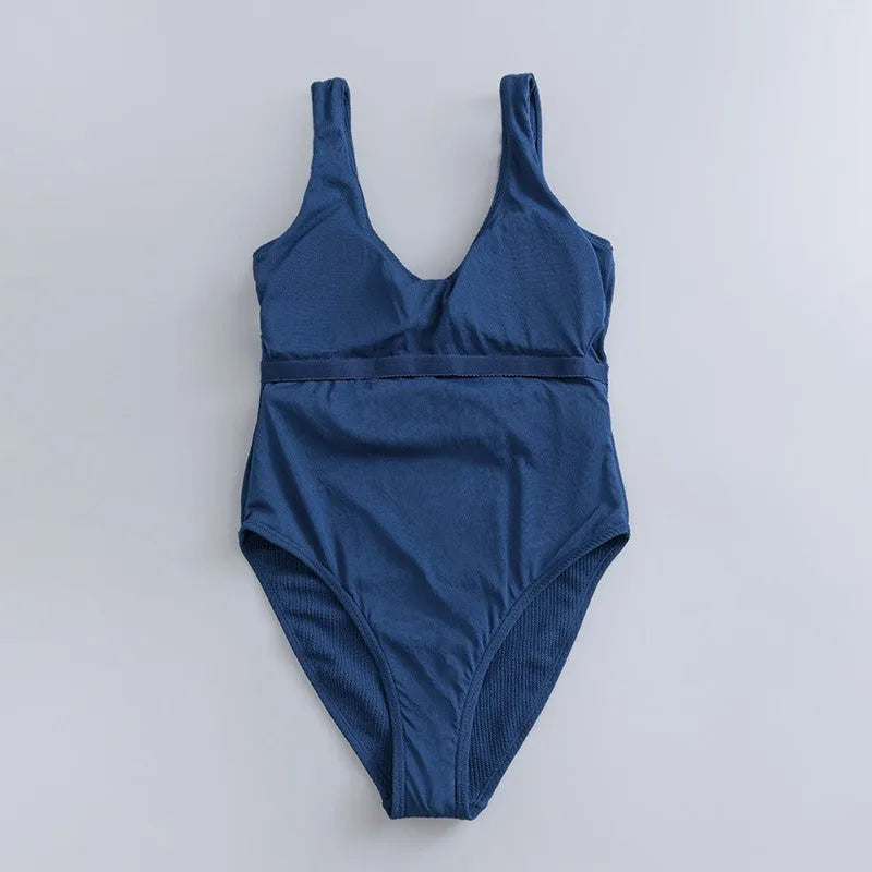 Navy blue women's one-piece swimsuit with slimming triangle design and chest pad for swimming