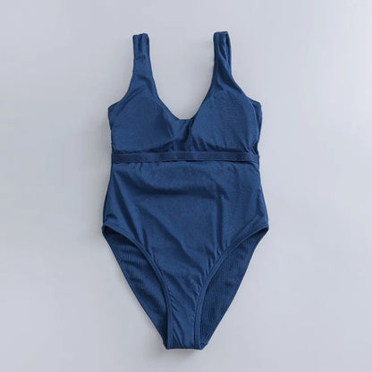 Navy blue women's one-piece swimsuit with slimming triangle design and chest pad for swimming