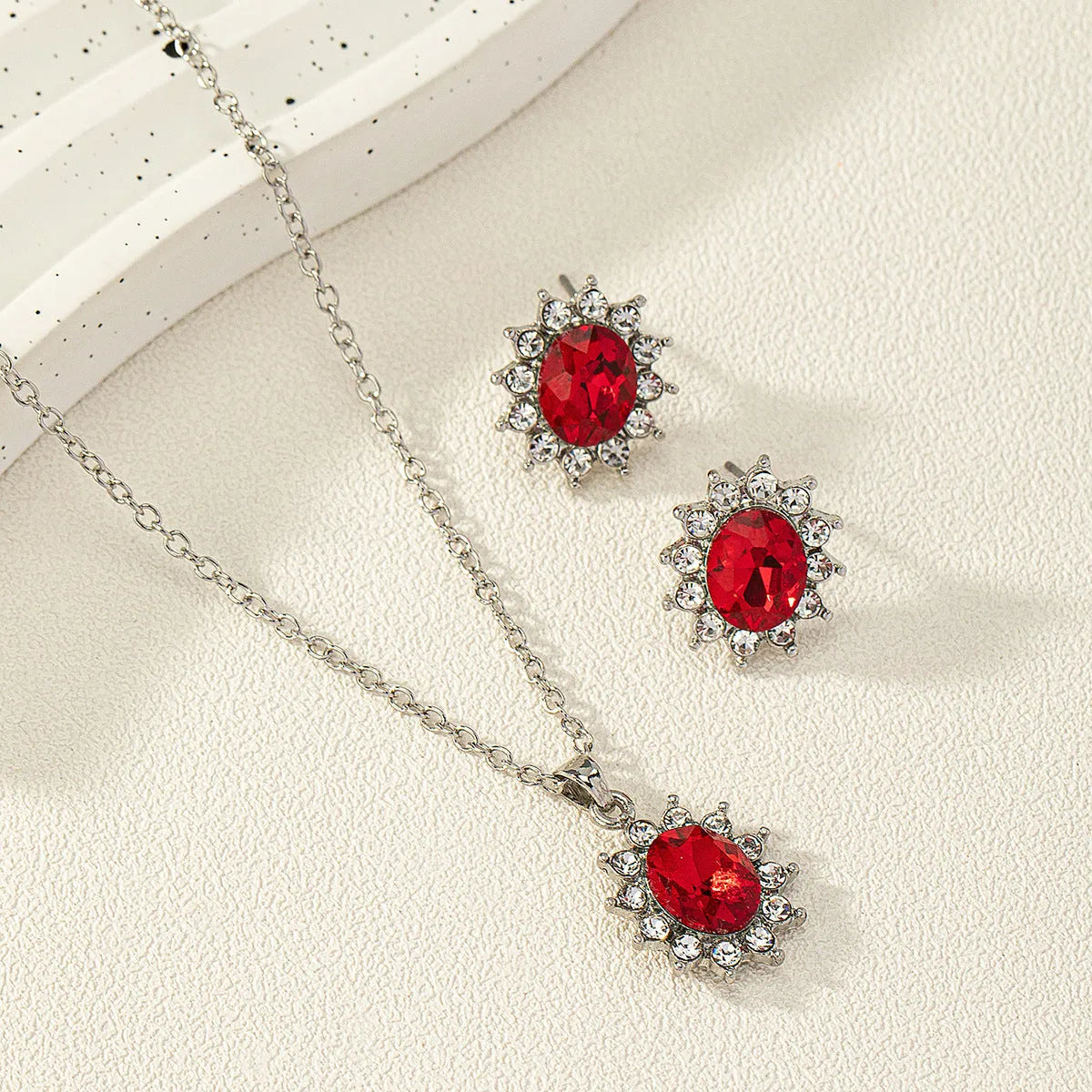 Sunflower zircon necklace and earring set in alloy with electroplated finish showing ellipse-shaped design