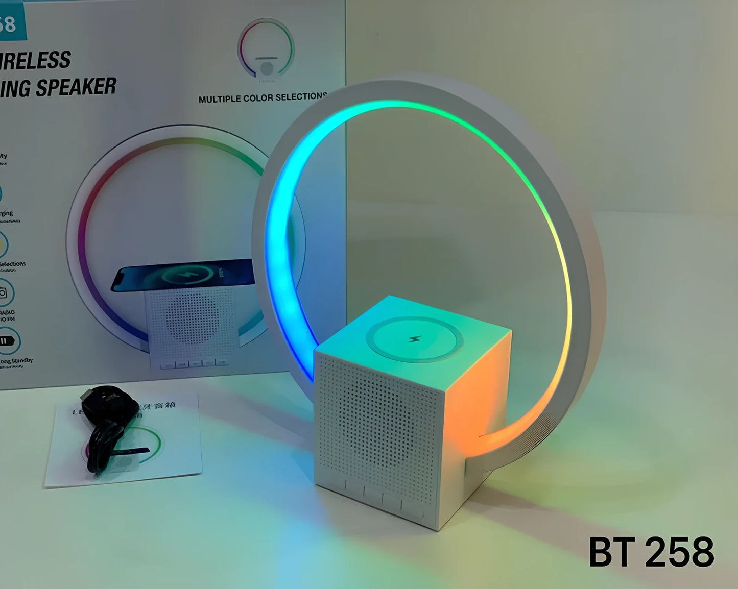 White smart speaker with wireless charging surface, LED lights, and Bluetooth connectivity