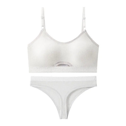 White underwired sports bra set with contrast dark grey back detailing and matching briefs on a mannequin.