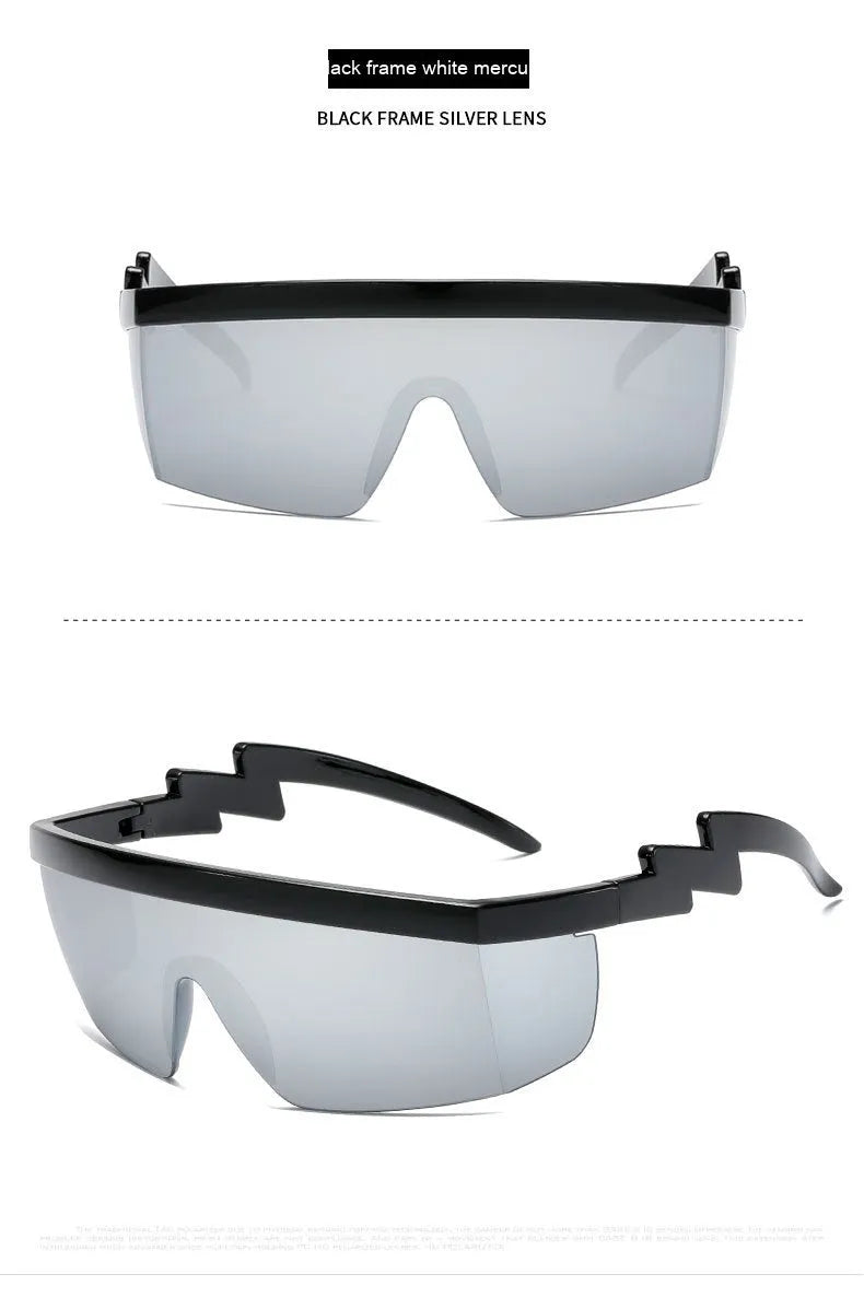 Black one-piece cycling sunglasses with blue polycarbonate lenses and lightning leg temples on a grey background.
