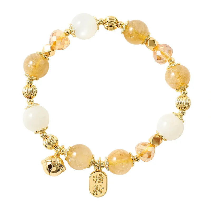 Gold electroplated bracelet with a rutilated quartz charm in Lucky Fortune colour.