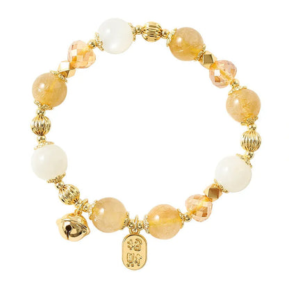 Gold electroplated bracelet with a rutilated quartz charm in Lucky Fortune colour.