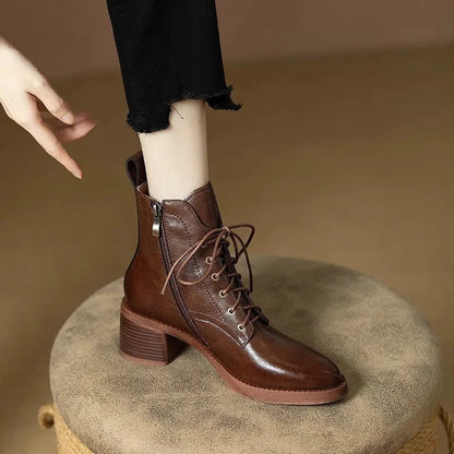 Women's black pointed toe short tube boots with a 5.5cm heel on a white background.