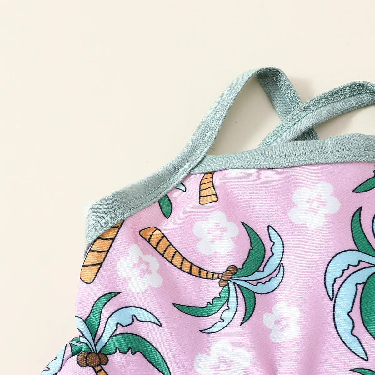 White polyester two-piece swimsuit set with top and shorts for a baby or toddler.