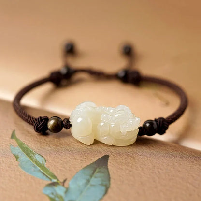 Hetian jade bracelet with black and red adjustable ropes in traditional Chinese design