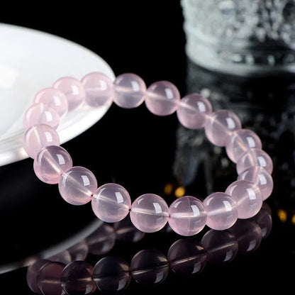 Natural starlight crystal bracelet with polished pink beads in multiple size options
