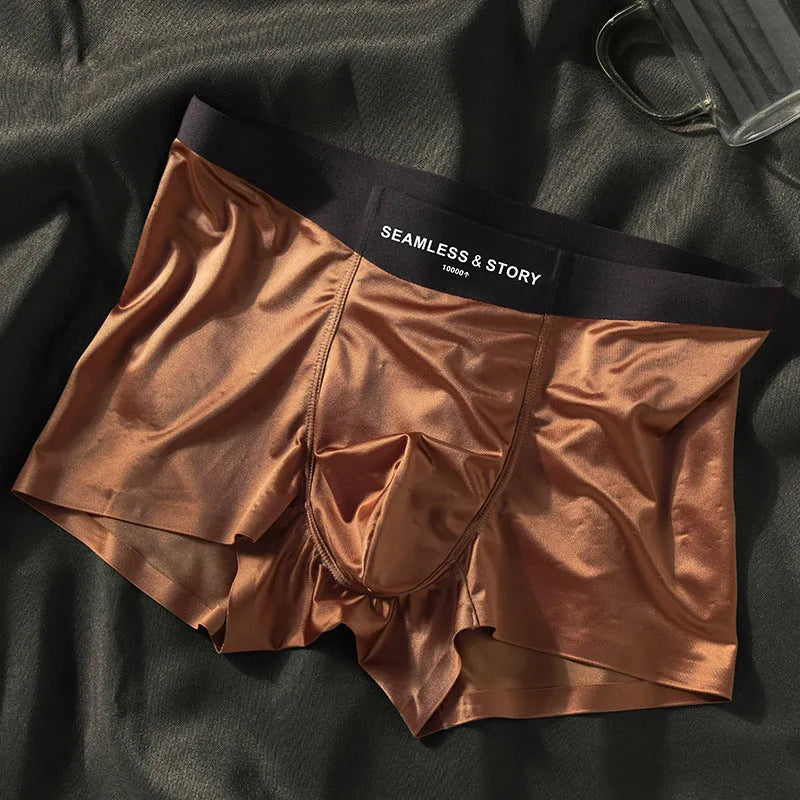 Men's solid colour satin ice silk boxer shorts laid flat, showing mid-waist design.