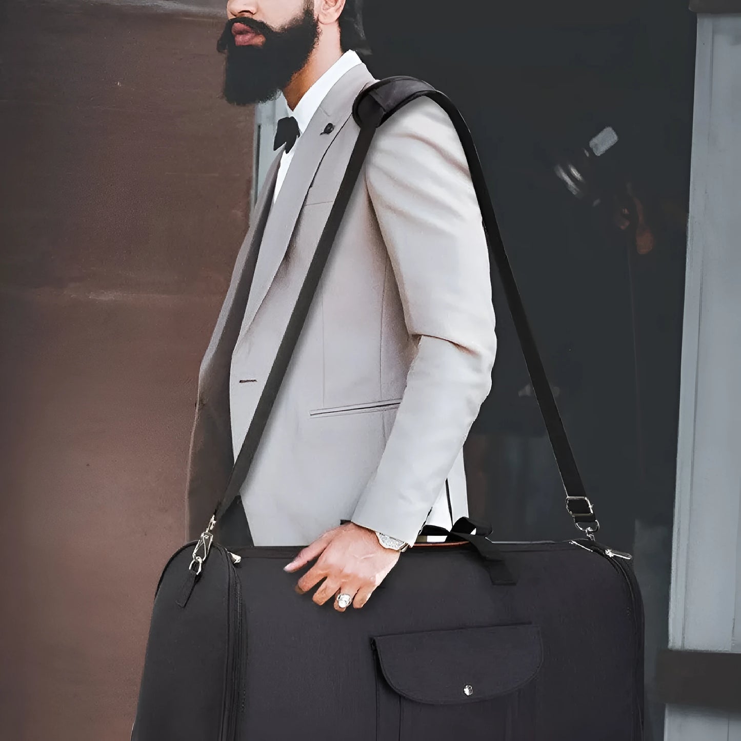 Folding duffel travel bag in dark blue Oxford cloth, shown packed and folded flat.