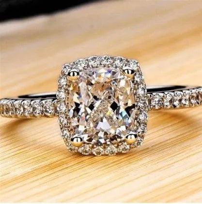 Women's silver colour alloy ring with artificial gemstone inlay and geometric design, bridal style.