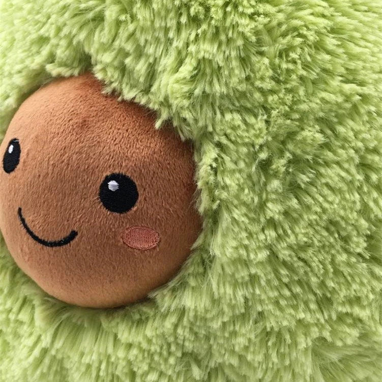 Cosy and plush avocado-shaped cushion in various sizes, providing soft comfort and relaxation for the home