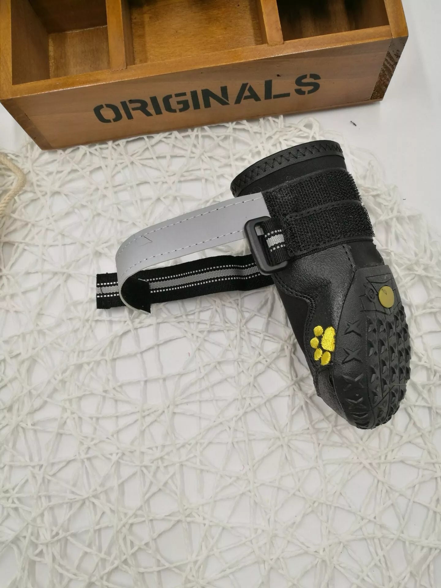Black waterproof dog shoes with non-slip soles and adjustable fuzzy belt