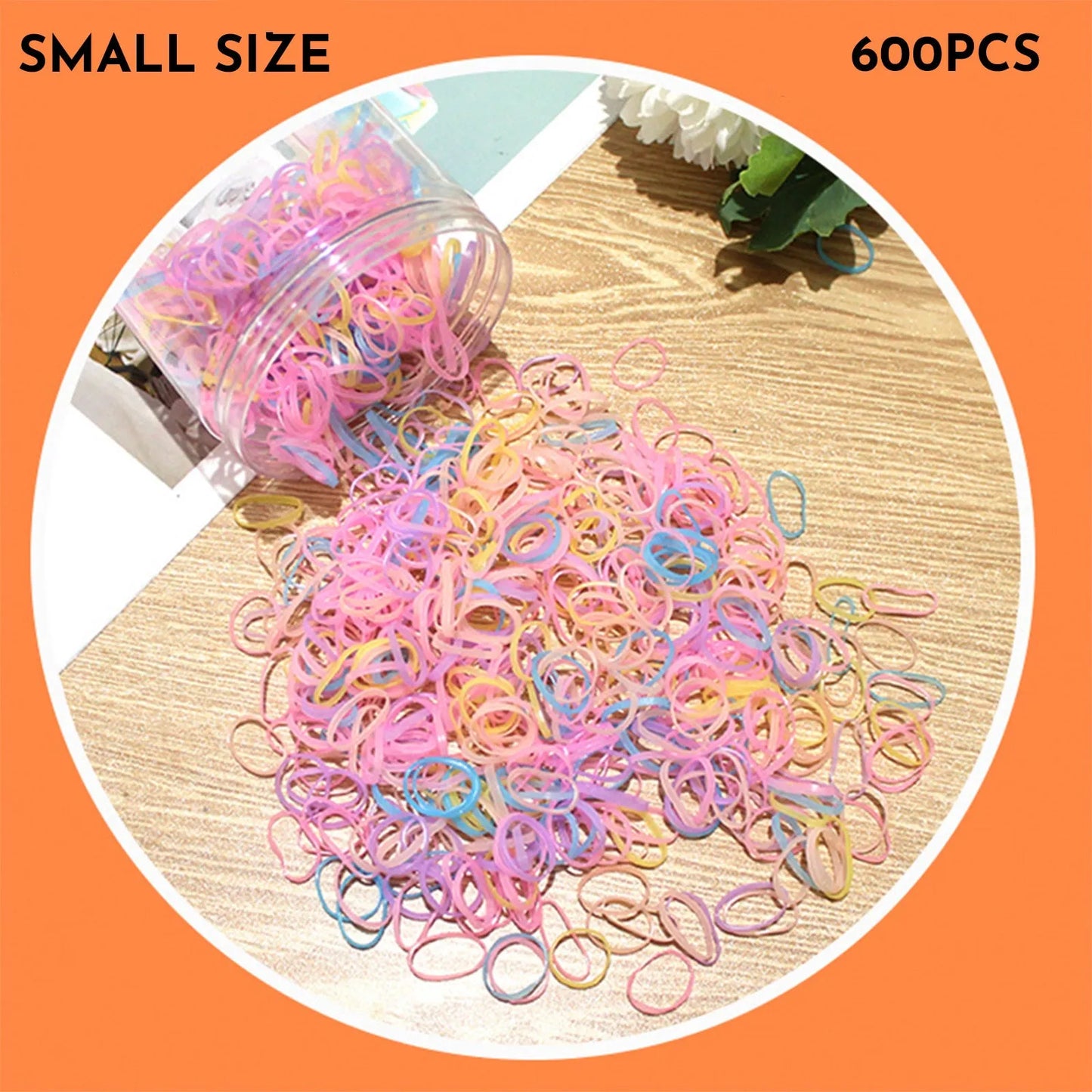 Assorted colourful thin TPU baby hair ties for toddlers and kids in a reusable plastic storage container.