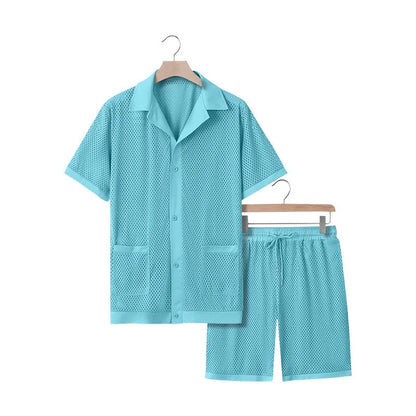 Light blue see-through beach shorts suit with matching cardigan on a summer background.