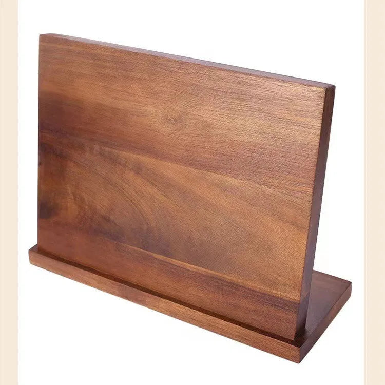 Solid wood magnetic knife holder in wood colour for kitchen storage.