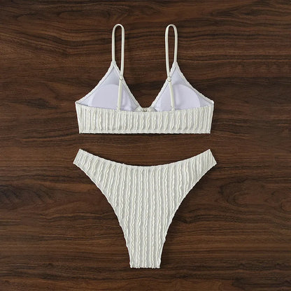 Women's white V-neck two-piece swimsuit with sleeveless top and matching shorts