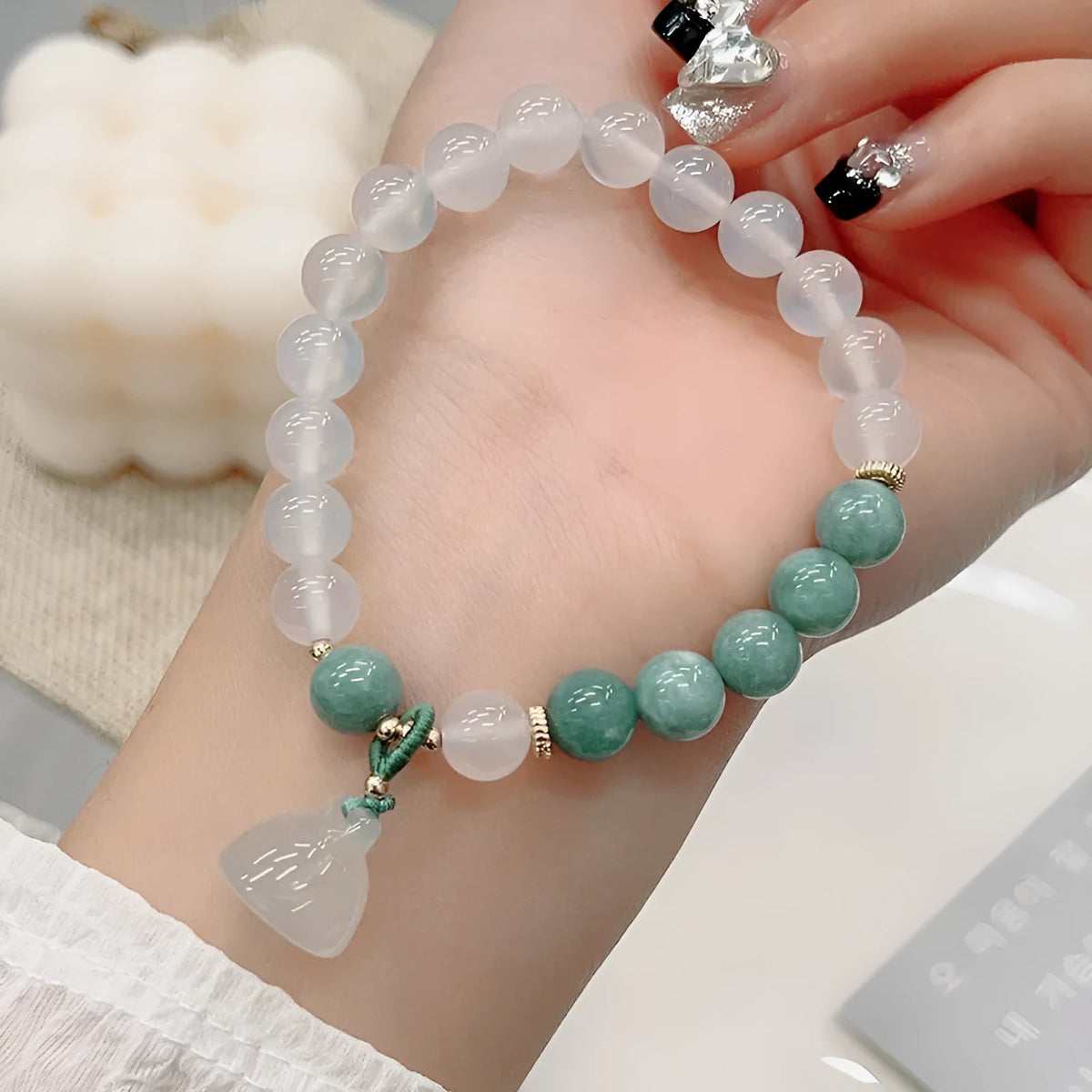 Women's retro Chinese style agate lotus seedpod bracelet showing natural stone patterns