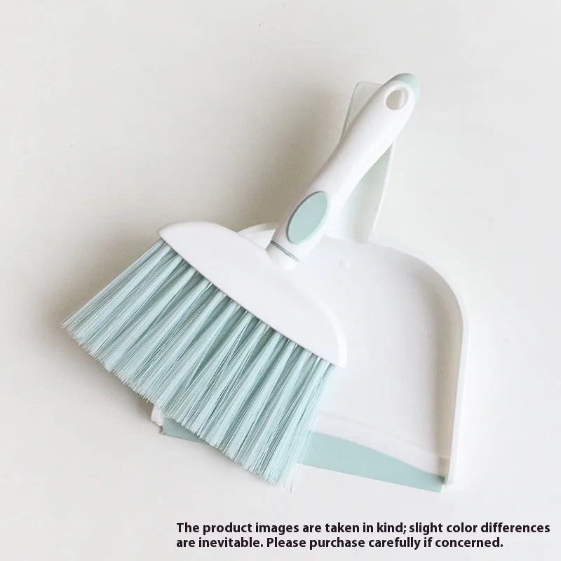 Small plastic handheld dustpan and brush cleaning kit in assorted colours.