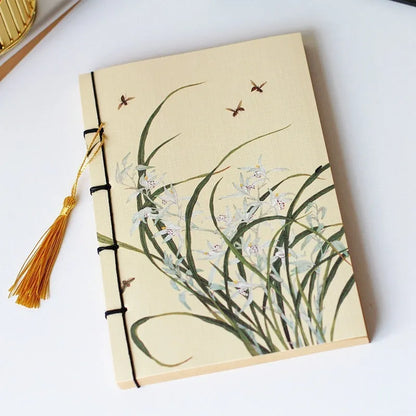 A5 antique wire-bound notebook with classical artwork cover, black oil wax rope binding, and decorative tassels
