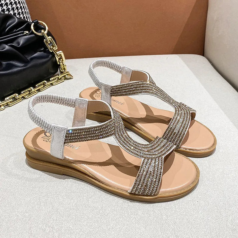Women's patent leather beach sandals with rhinestone decoration and non-slip soles in gold colour
