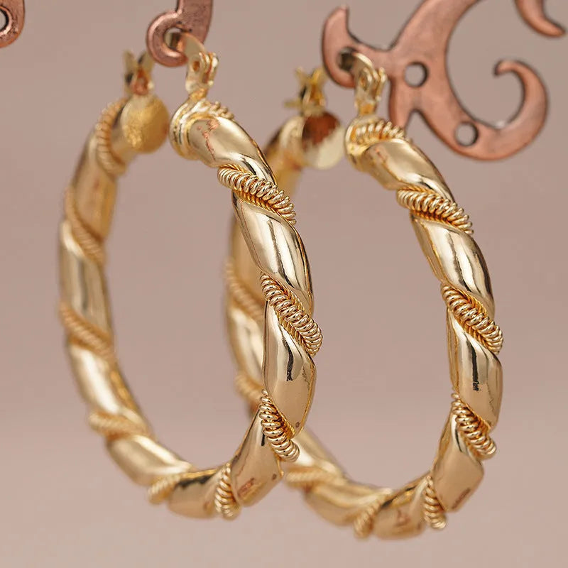 Geometric copper ear clips for women with ring and line elements in golden colours