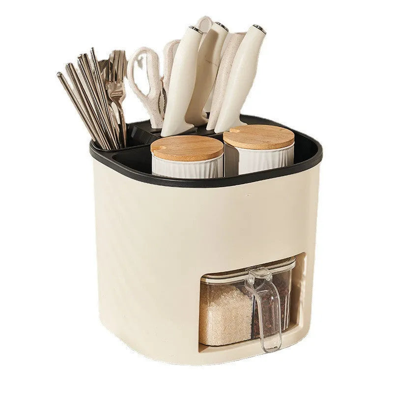White rotating plastic kitchen storage bucket and a separate white spice box with four compartments on a countertop.