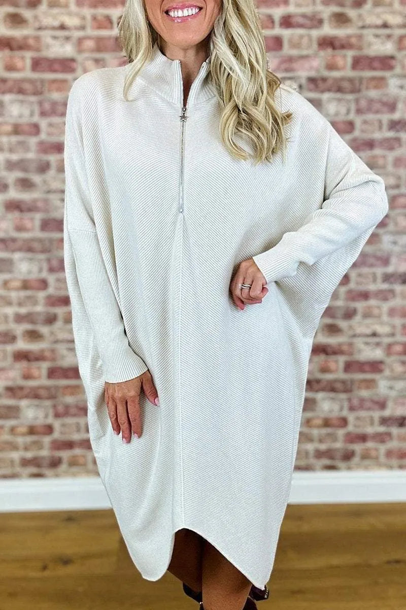 Women's solid colour loose knitted dress with a front zipper and raglan sleeves.