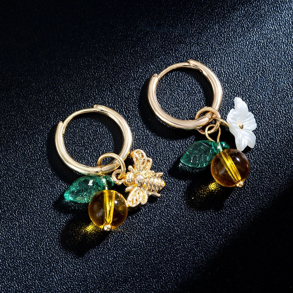 Adjustable women's ear cuffs with bee-shaped pendant, glass leaves, and floral elements in XY-123 colour