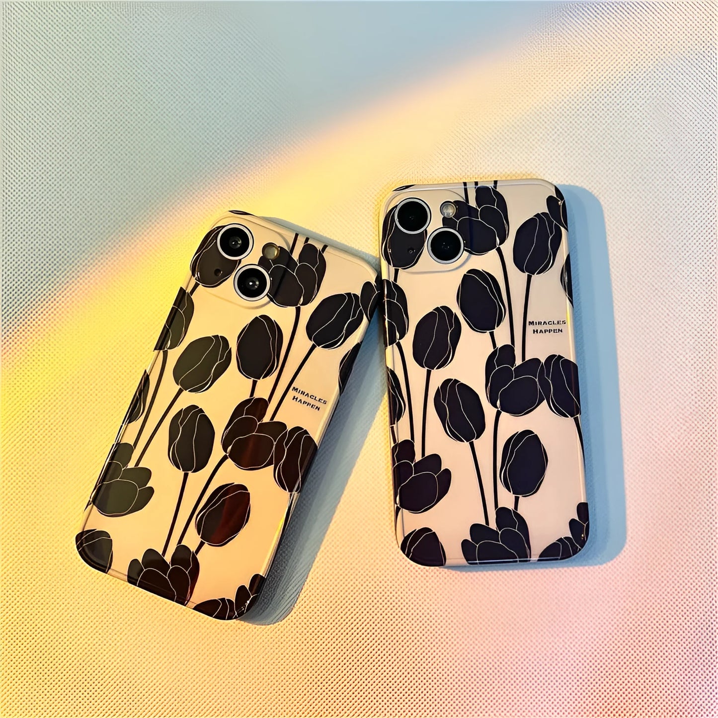Black silicone iPhone case with a tulip floral pattern on the back.