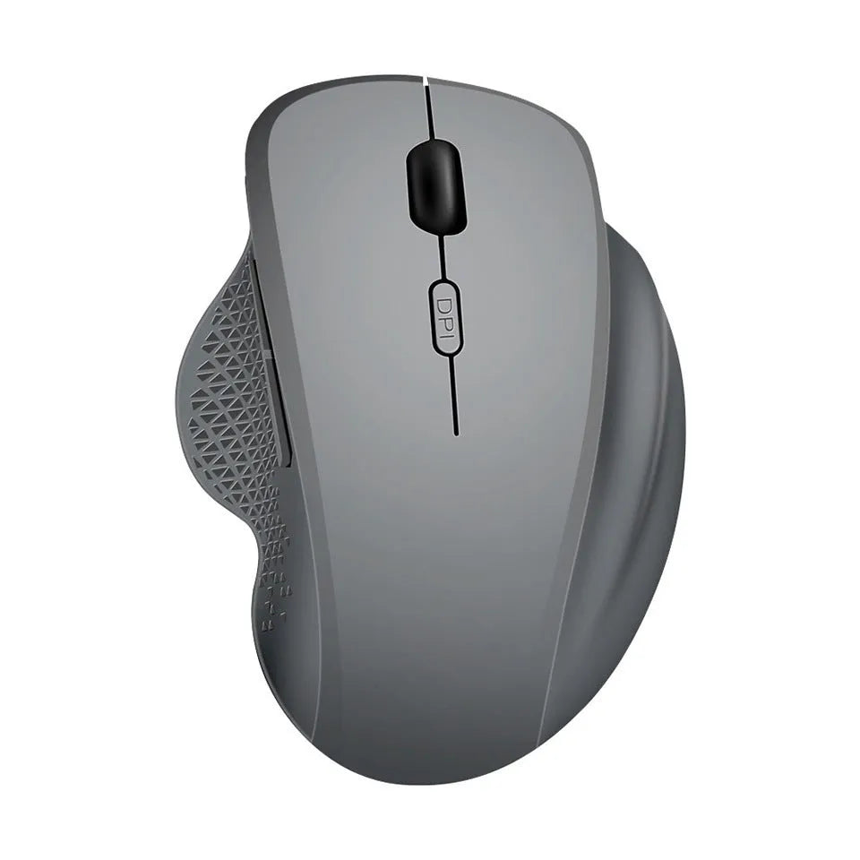 Grey and black wireless notebook mouse with USB charging cable on a laptop keyboard