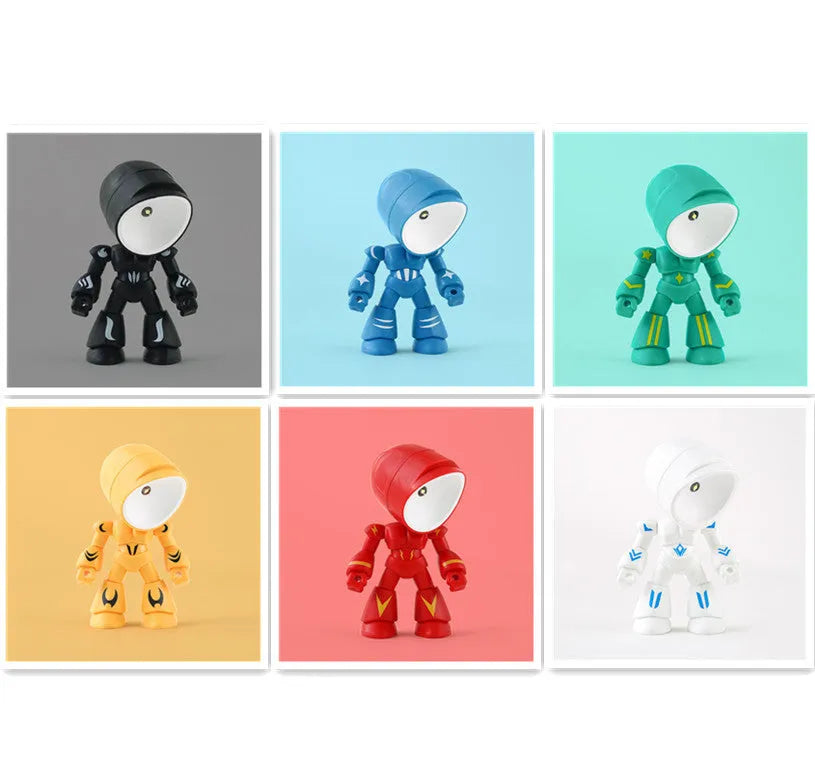 Mini mecha robot hero LED night light with adjustable arms on a desk.