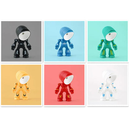 Mini mecha robot hero LED night light with adjustable arms on a desk.