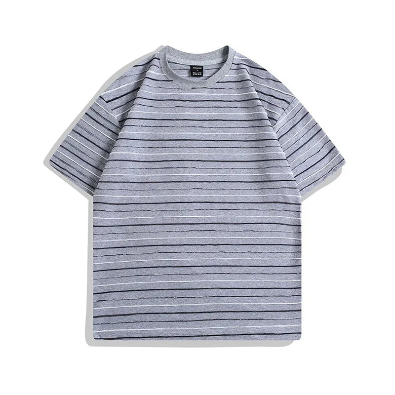 Man wearing a loose-fit striped short sleeve t-shirt with a round neck in a grey colour.