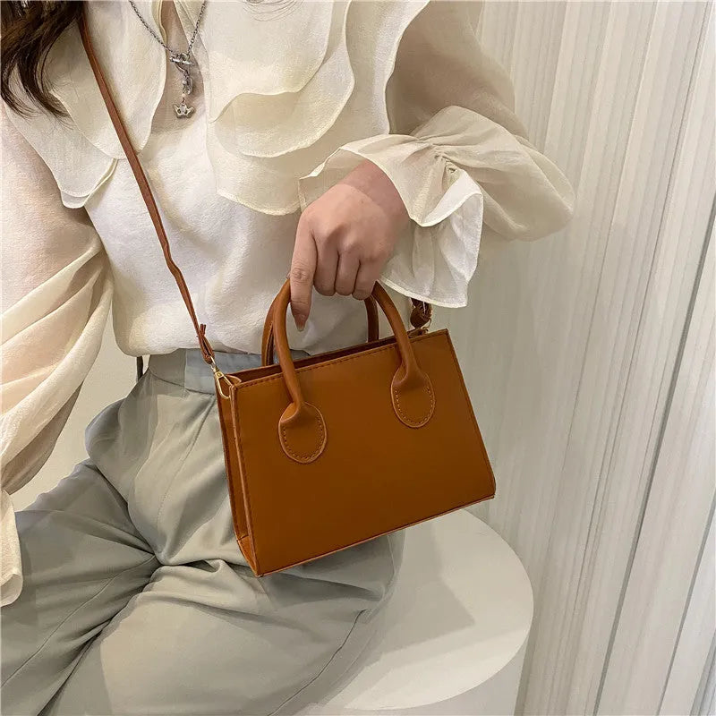 Women's small square PU leather shoulder bag in five colour options showing retro street styling