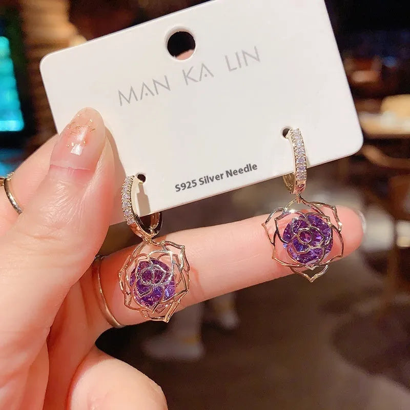 Geometric copper women's earrings with zircon accents and rose design elements in multiple colour variations
