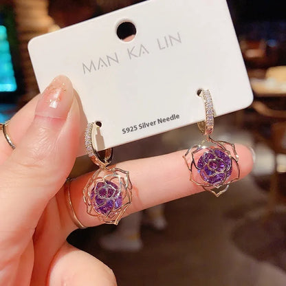 Geometric copper women's earrings with zircon accents and rose design elements in multiple colour variations