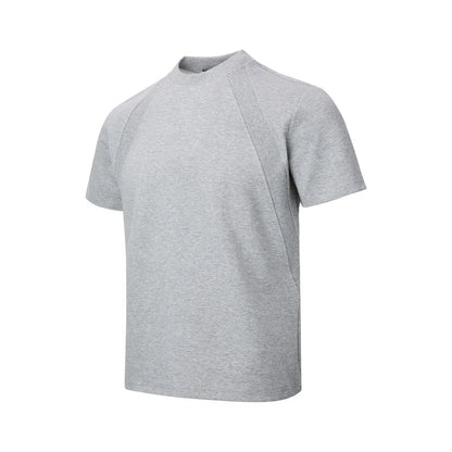 Loose-fit black short sleeve top with textured air layer stitching on a mannequin.