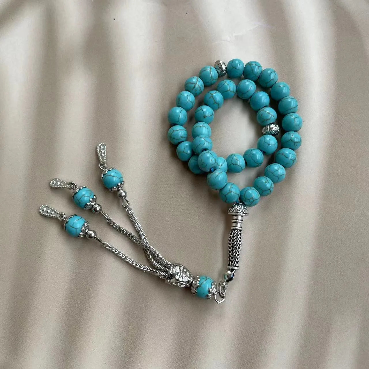 Sky blue stone bead Muslim prayer bracelet with 8mm beads on a single strand.