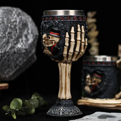 Red wine glass with stainless steel stem and detailed resin couple skeleton decoration, 200ml capacity