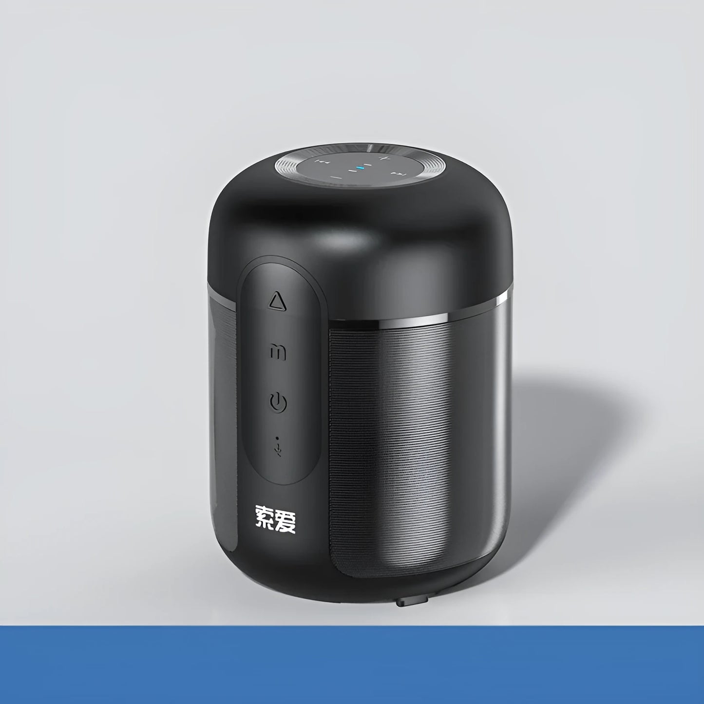 Compact black portable Bluetooth speaker with 30W output and 1500mAh battery, shown on a table.