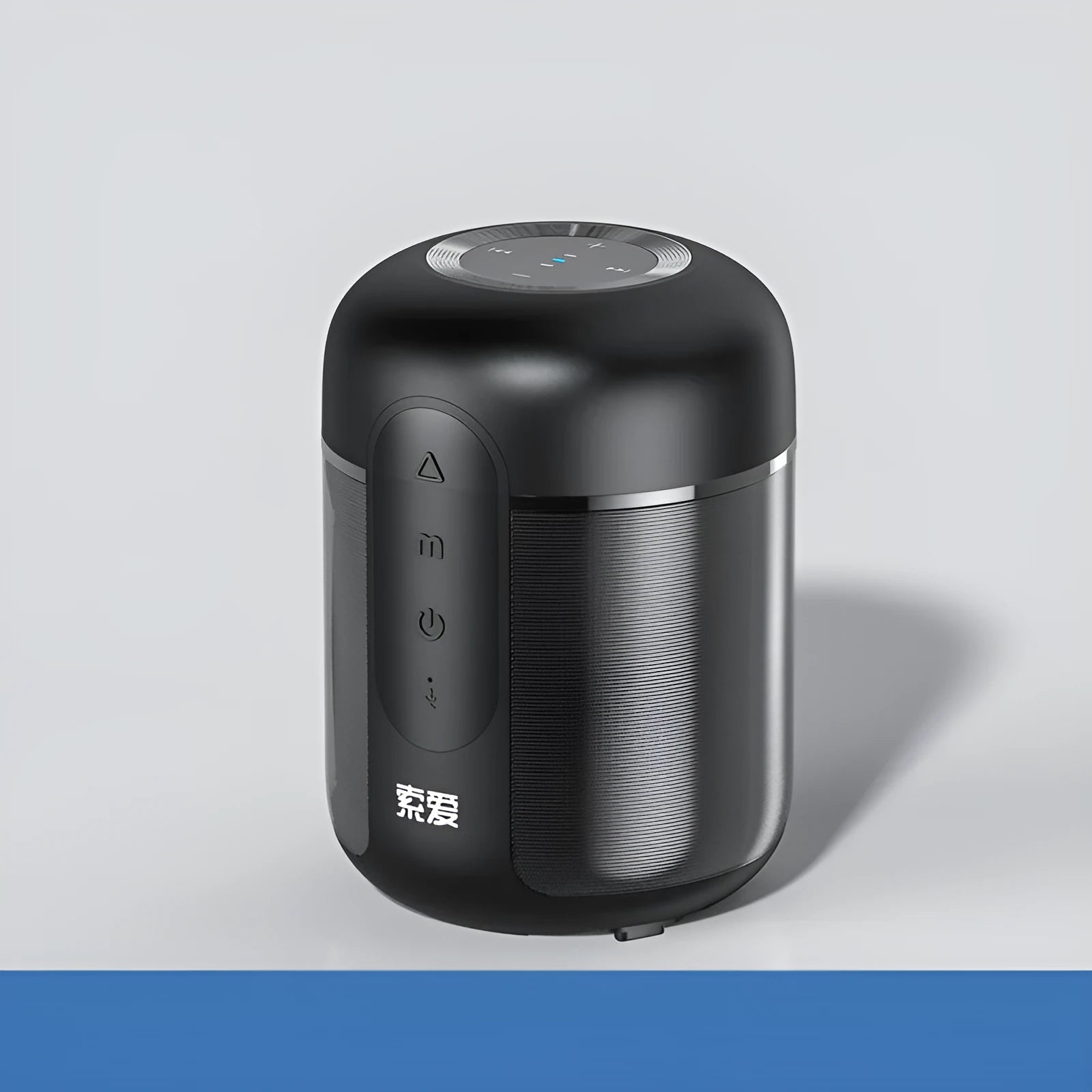 Compact black portable Bluetooth speaker with 30W output and 1500mAh battery, shown on a table.