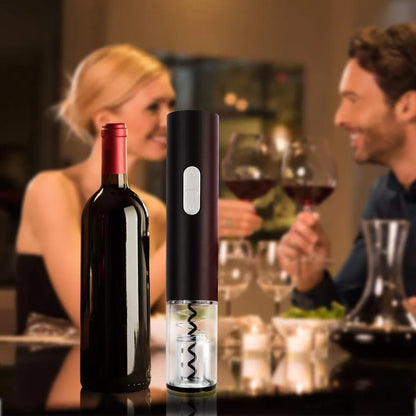 Black automatic electric wine opener with foil cutter showing battery compartment and cork removal mechanism