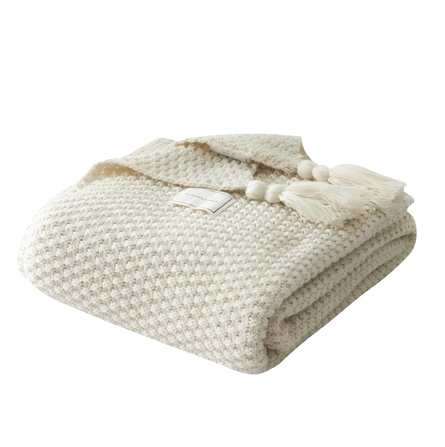 Fringed knitting blanket in beige colour showing 5cm fringe detailing and dense acrylic weave texture