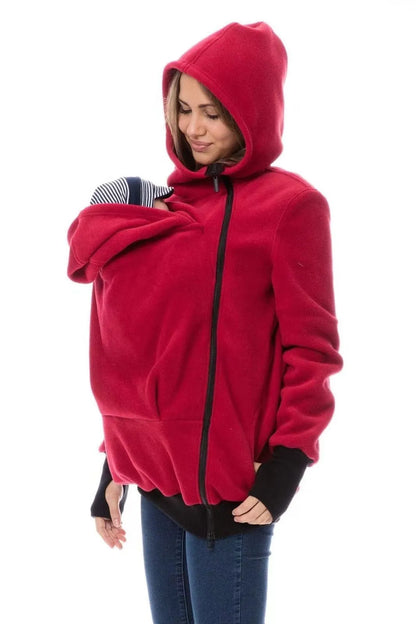 Red loose fit women's polar fleece sweater with long sleeves on a hanger