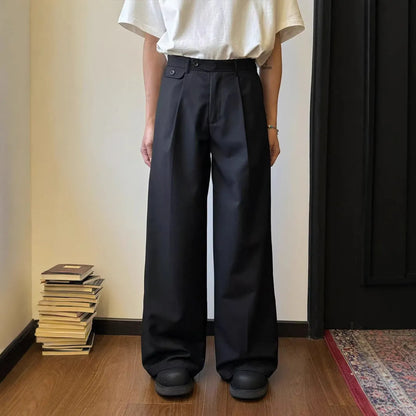 Man wearing straight-leg wide-leg casual trousers in brown, showcasing the relaxed drape and fit.