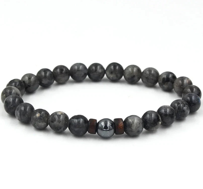 A stylish and durable men's bracelet made with volcanic stone, flash stone, and wood chips